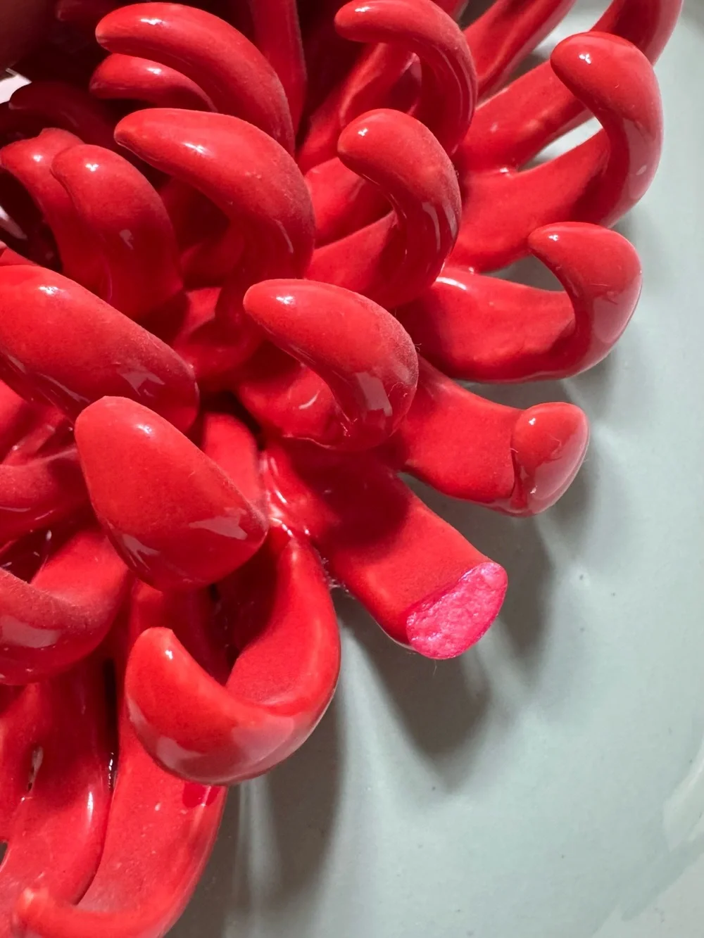 Anthropologie Ceramic Vase features a 3D red chrysanthemum bloom against a celad